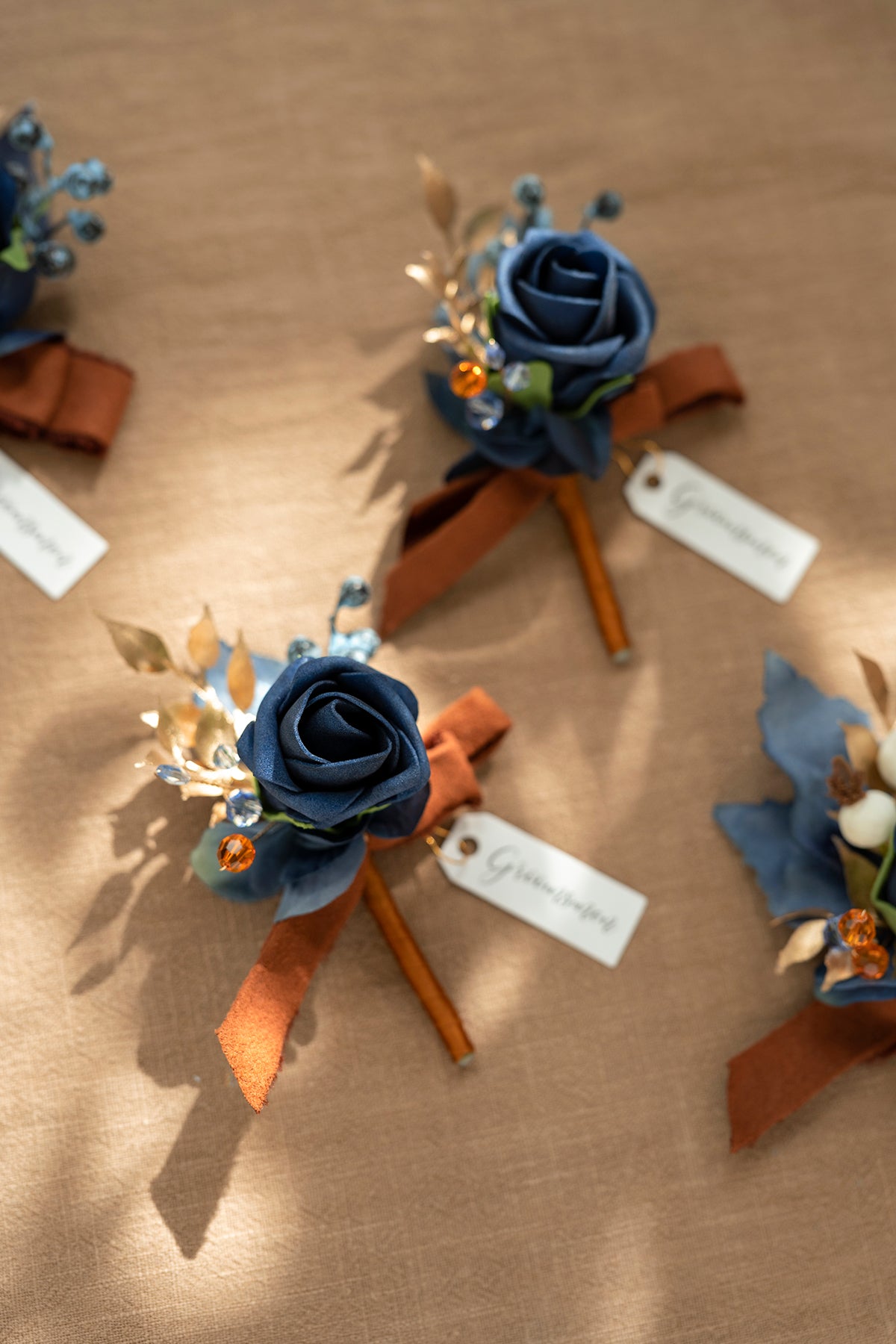 Boutonnieres in Russet Orange & Denim Blue