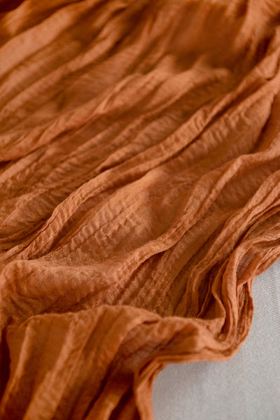 Table linens in Sunset Terracotta