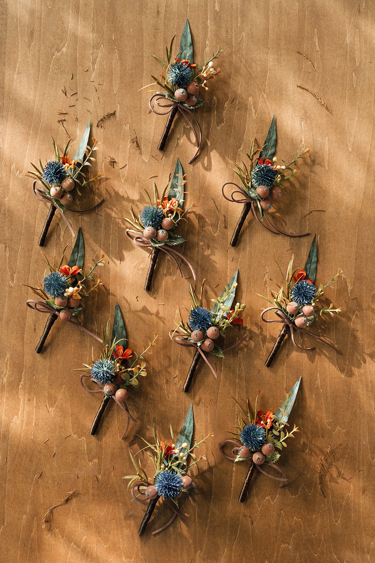Boutonnieres for Guests in Dark Teal & Burnt Orange